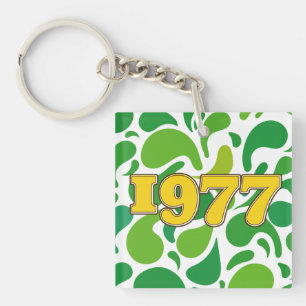 Vintage 1977 metal print key ring
