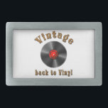 Vintage - Back to Vinyl, the record is back Belt Buckle<br><div class="desc">The image shows a vinyl record,  a type of physical audio recording format made from vinyl material. The phrase "back to basics" suggests a return to older,  traditional forms. The feeling of nostalgia for music and the desire for the past to become current again</div>