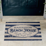 Vintage Beach House Personalised Navy Blue Doormat<br><div class="desc">Our personalised, vintage style beach house doormat makes a unique and welcoming addition to your summer abode! Design features nautical navy blue and tan stripes and vintage style lettering, with your family name and year established for a unique customised touch. A curled rope illustration completes the design, while a unique...</div>
