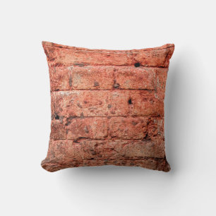 Vintage brick wall with some stones in it, brick cushion