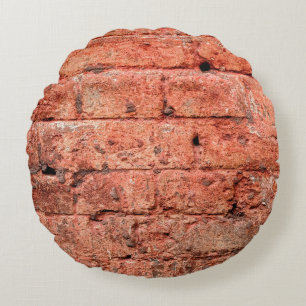 Vintage brick wall with some stones in it, brick round cushion