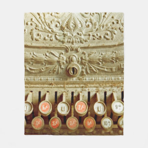 Vintage cash register, covered in dust and cobweb fleece blanket