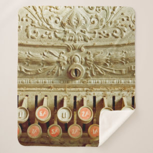 Vintage cash register, covered in dust and cobweb sherpa blanket