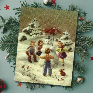 Vintage Children Making a snowman Postcard
