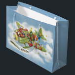 Vintage Christmas, Santa Claus Flying an Aeroplane Large Gift Bag<br><div class="desc">Vintage illustration Merry Christmas holiday travel and transportation design featuring a jolly Santa Claus flying an old fashioned propeller aircraft in the sky with elves, toys, dolls, wrapped presents and a Christmas tree on the wing. They are flying the antique plane through the fluffy white clouds and stars in the...</div>