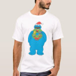 Vintage Cookie Monster Christmas Wreath T-Shirt<br><div class="desc">Celebrate the holiday season with Sesame Street! This vintage graphic features Cookie Monster eating a Christmas wreath.   © 2021 Sesame Workshop. www.sesamestreet.org</div>