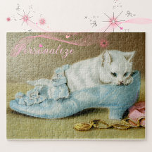 Vintage cute white kitten in a blue satin shoe