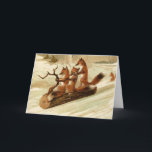 Vintage Foxes Sledding Christmas Card<br><div class="desc">This adorable card has three red foxes sledding down a snowy hill on a log</div>