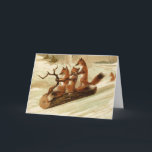 Vintage Foxes Sledding Christmas Card<br><div class="desc">This adorable card has three red foxes sledding down a snowy hill on a log</div>