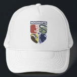 Vintage HOGWARTS™ Stamped Crest Trucker Hat<br><div class="desc">Show your house pride in bold, vintage-inspired style with this striking Hogwarts™ crest design. Featuring graphic silhouettes representing the four iconic houses — Gryffindor™, Slytherin™, Hufflepuff™, and Ravenclaw™ — this artwork blends classic symbolism with a modern, retro aesthetic. Each house emblem is set within a clean, color-blocked shield, creating a...</div>