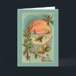 Vintage Holly, Christmas Bells and Snow Scene Holiday Card<br><div class="desc">Colourful Victorian Christmas greeting card illustration featuring brass bells,  A Merry Christmas greeting in ornate typography,  starry sky and round inset with vignette of a man carrying a Christmas tree in the snow with trees and village at sunset. Background colour is customisable. Back features complementary graphics and text fields.</div>