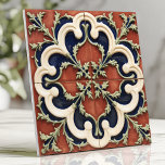 Vintage Italian Terracotta and Navy Ceramic Tile<br><div class="desc">This vintage Italian design showcases a striking combination of terracotta red, creamy white, and navy blue in elegant quatrefoil motifs accented with intricate vine details. The hand-crafted look and symmetrical pattern evoke timeless Mediterranean charm, perfect for enhancing backsplashes, accent walls, or decorative features. With its harmonious colour palette and exquisite...</div>