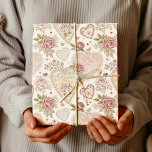 Vintage Ivory Rose Embroidered Heart Pattern Wrapping Paper<br><div class="desc">This vintage floral design has an ivory background decorated with soft pink roses and delicate green leaves. At the centre of the pattern appear large ornamental hearts with subtle embroidered and embossed details that give the whole design an elegant and timeless look. The mix of gentle florals and decorative hearts...</div>