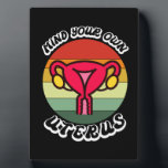 Vintage Mind Your Own Uterus Funny Feminist Gift Plaque<br><div class="desc">Vintage Mind Your Own Uterus Cute Feminist Gift
Reproductive Rights Shirt 
Pro Choise Shirt
reproductive rights, feminist, choise, vintage, feminism, gift ideas, my body my choice, girl power, women, equality, strong, pink, girl, equality, abortion, cuterus, pro choice, uterus, womens rights, abortion right, lgbtq, female, choise, gifts</div>