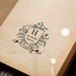 Vintage Monogram Crest Ex Libris Custom Name Book Self-inking Stamp<br><div class="desc">Self-inking stamp design featuring a vintage-style crest with your custom monogram and name in classic serif typography. The ornate frame is surrounded by a floral arrangement of roses and botanical leaves. Below the crest, there is a ribbon-style scroll or banner with "Ex Libris" curved along the inside. Perfect for a...</div>