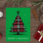 Vintage Plaid Christmas Tree Holiday Card<br><div class="desc">Send classic holiday cheer with this charming card featuring a bold Christmas tree decorated in red and green plaid on a festive green background. The words Merry Christmas appear at the bottom in a timeless font, making it perfect for friends, family, and coworkers. A great choice for anyone who loves...</div>