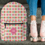 Vintage Retro Diamond Pattern Pink Monogram Printed Backpack<br><div class="desc">This stylish backpack features a vintage / retro diamond pattern in shades of berry red, magenta pink, light pink, gold, mint green, and light aqua blue. A monogram text template is included for simple personalisation - customise it or remove the template and circle if no monogram is desired. Great for...</div>
