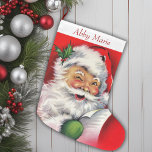 Vintage Santa Checking His List Personalised Large Christmas Stocking<br><div class="desc">This charming Christmas stocking beautifully captures the nostalgic essence of mid-century holiday cheer. Adorned with a delightful image of Santa Claus meticulously checking his list, this stocking harkens back to classic Christmases of yesteryear. Santa, dressed in his traditional red suit with a twinkle in his eye, exudes warmth and jollity,...</div>