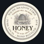 Vintage Skep Local Honey Jar Label Ivory<br><div class="desc">A nice old-fashioned-looking label with a dainty double border of dots and a delicate line surrounds this pale ivory Honey Jar Label with Vintage Skep Illustration. It has a double curved text border with room for Apiary Name and Location at top of label, and honey description at bottom. The word...</div>