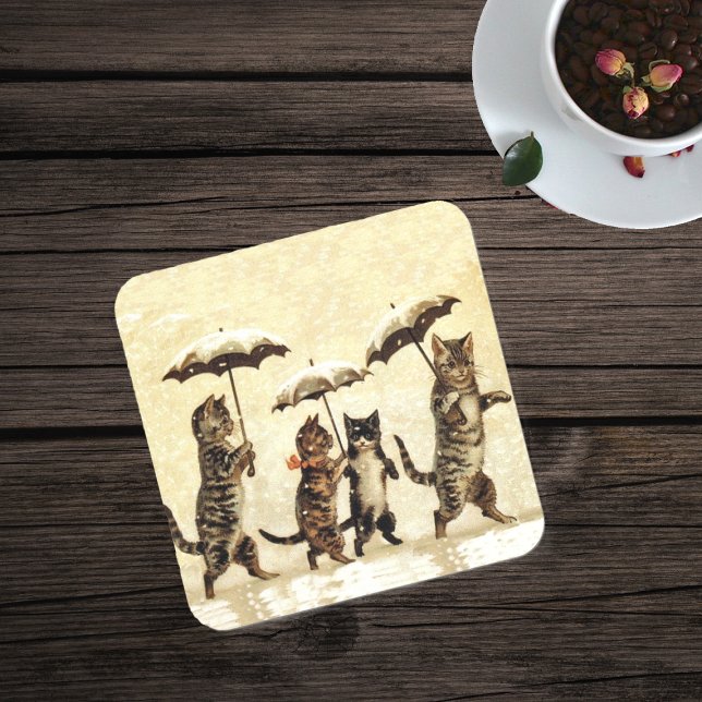 Vintage Striped Cats Umbrellas Dancing Snow Coaster (Four brown cats walking in snow with umbrellas on drink coaster in yellow.)