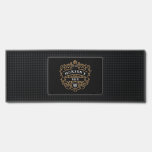 Vintage Style Custom Name Year Gold Black & White Bar Mat<br><div class="desc">Add an elegant touch to your home bar with this custom bar mat featuring a sophisticated vintage design. The black background is adorned with intricate golden scrollwork framing your personalised bar name in classic white lettering, creating a refined and timeless look. The design is complemented by a hop emblem, adding...</div>