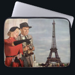 Vintage Tourists Travelling in Paris Eiffel Tower Laptop Sleeve<br><div class="desc">Vintage illustration travel and transportation image featuring vacationing newlyweds sightseeing in Paris, France with the Eiffel Tower in the background. A love and romance design with a man and woman on a romantic vacation, a couple in the city of lights on their honeymoon. She is holding a map of the...</div>