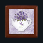 Violets In Teapot Gift Box<br><div class="desc">This Pretty Gift Box features Violets in a white tea pot and is perfect for holding trinkets or jewellery.</div>