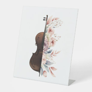 Violin among flowers. Bouquet of flowers. Pedestal Sign
