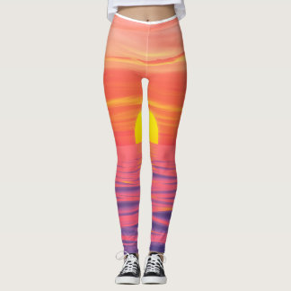 Vivid colour sunset on the beach leggings