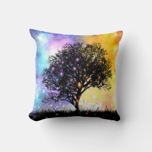 Vivid surreal sunset with black silhouette tree cushion