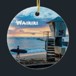 Waikiki O'ahu Ceramic Ornament<br><div class="desc">A unique gift or keepsake for the Hawaiian traveller.  A lifeguard tower at Queen's Beach at dusk on front and a growing pineapple on the back. Waikiki and the year can be changed,  if desired.</div>
