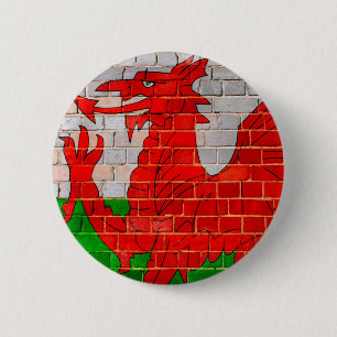 Wales flag on a brick wall 6 cm round badge