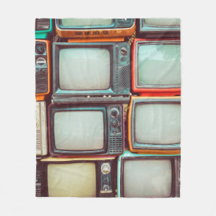 Wall of pile colourful retro television fleece blanket