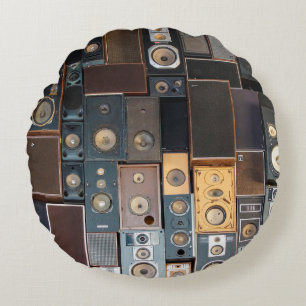 Wall of speakers round cushion