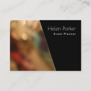 Warm, blurred photo beside solid black diagonal business card