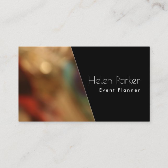 Warm, blurred photo beside solid black diagonal business card (Front)