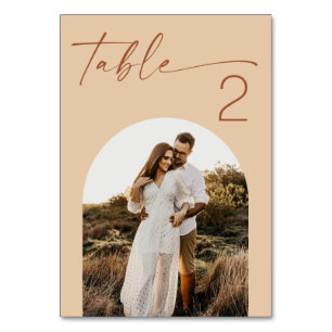 Warm Peach Sand Wedding Modern Script Arch Photo Table Number