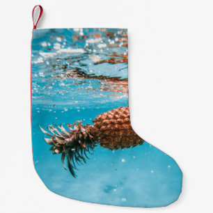 Water droplets on brown plant small christmas stocking