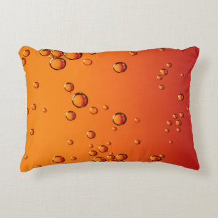 Water droplets on orange surface decorative cushion