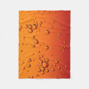 Water droplets on orange surface fleece blanket