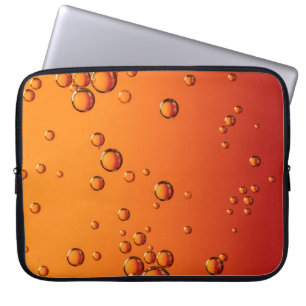 Water droplets on orange surface laptop sleeve