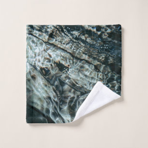 Water drops on body of water wash cloth