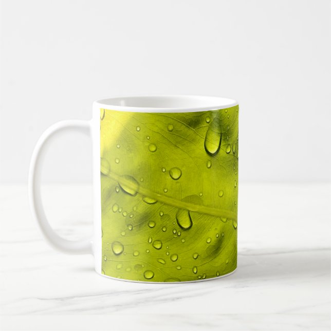 Water drops on green leaf coffee mug (Left)