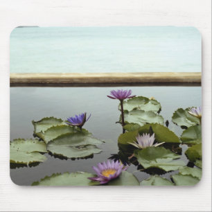 Water lilies in pond by ocean mouse pad