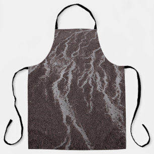 Water on sand on shore apron