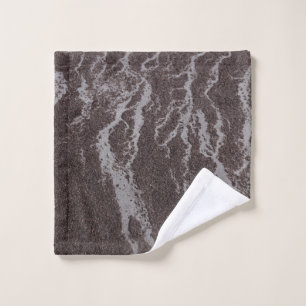 Water on sand on shore wash cloth