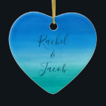 Watercolor Beach Wedding Couple Ceramic Ornament<br><div class="desc">This beachy wedding design features a background of deep blues and greens with space on the front for the couple's names and the wedding date on the back. Click the customise button for more flexibility in modifying the text! Variations of this design as well as coordinating products are available in...</div>