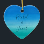 Watercolor Beach Wedding Couple Ceramic Ornament<br><div class="desc">This beachy wedding design features a background of deep blues and greens with space on the front for the couple's names and the wedding date on the back. Click the customise button for more flexibility in modifying the text! Variations of this design as well as coordinating products are available in...</div>