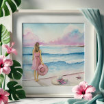 Watercolor By the Shoreline  Photo Print<br><div class="desc">"By the Shoreline" is one of my newest watercolor paintings of beach scenes, capturing a serene moment with soft pink artwork tones and a calm blue sea. This emotional piece of beach art features a woman at the water’s edge and a second beach hat resting in the sand—offering a quiet,...</div>