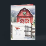 Watercolor Christmas Barn With Snowman Holiday Card<br><div class="desc">Red barn with a green Christmas wreath,  a snowman,  and a bird wearing a winter scarf on an old fence in snowflakes.
Text can be edited.</div>